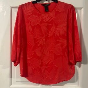 Pretty orange petite small top.